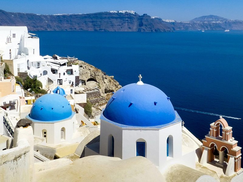 The blue domes of Oia standing above the Santorini caldera