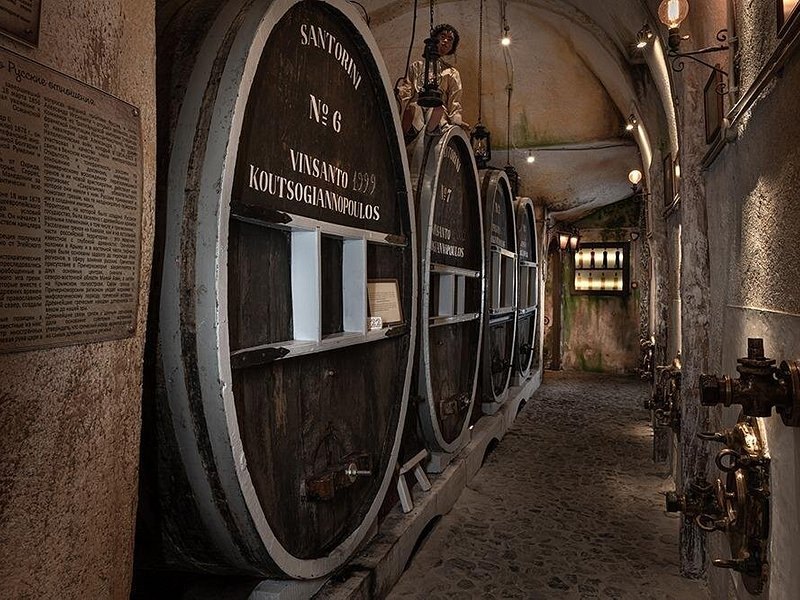 Old barrels resting in a cave cellar cut into the island's pumice